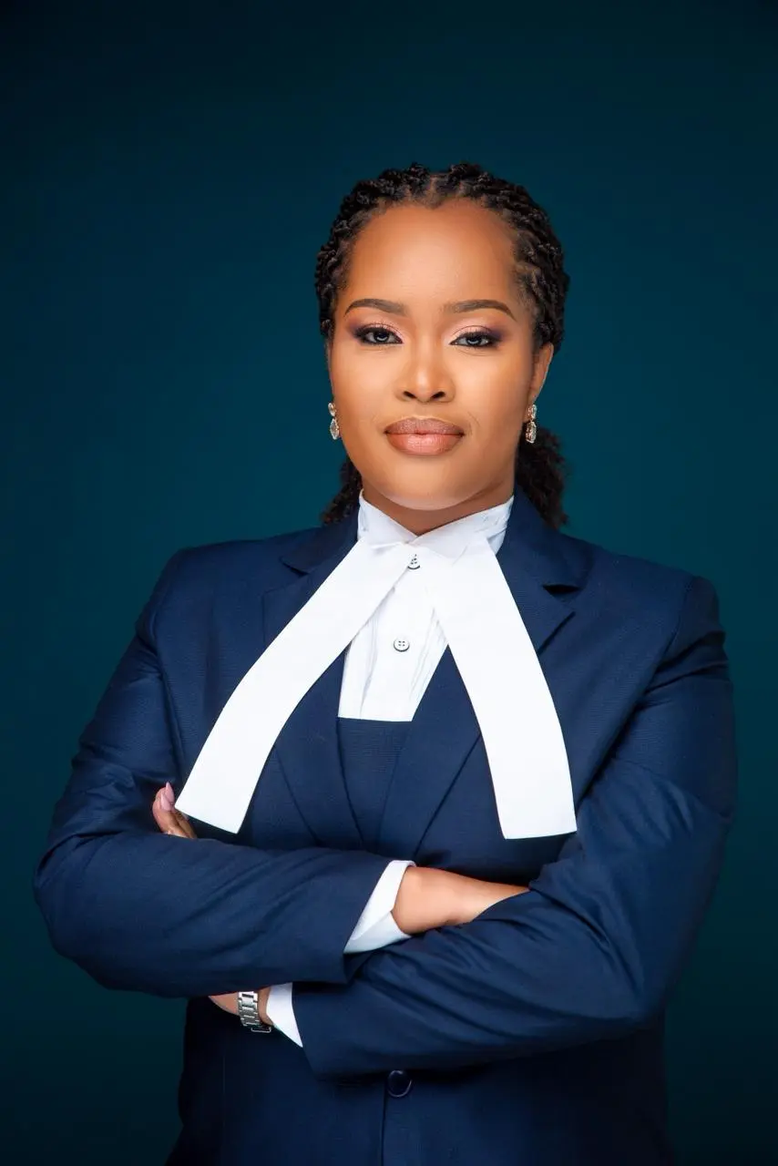 Bold female lawyer wearing official attire.